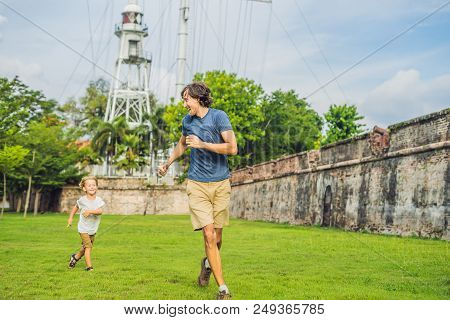 Dad And Son On Background Of Fort Cornwallis In Georgetown, Penang, Is A Star Fort Built By The Brit