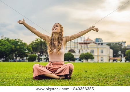Woman On The Background Of Old Town Hall In George Town In Penang, Malaysia. The Foundation Stone Wa