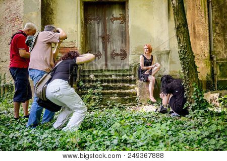 Jasa Tomic, Vojvodina, Serbia - June 3, 2017: Photographers Are Taking Photo Together Of Young Woman