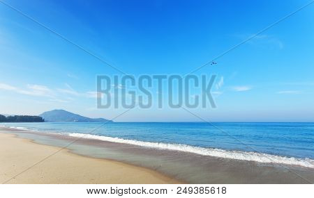 Tropical Andaman Seascape Scenic Off Mai Khao Beach And Wave Crashing On Sandy Shore In Phuket Thail