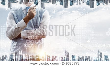 Double Exposure Of Confident And Young Businessman In Smart-casual Wear Smoking Pipe And Modern City