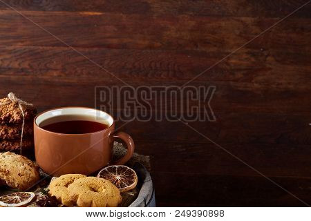 Cookies With Cinnamon And Two Cups Of Tea On A Burlap Napkin, Selective Focus, Close-up, Top View. D