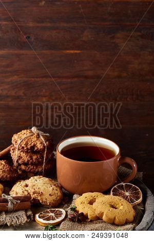 Cookies With Cinnamon And Two Cups Of Tea On A Burlap Napkin, Selective Focus, Close-up, Top View. D