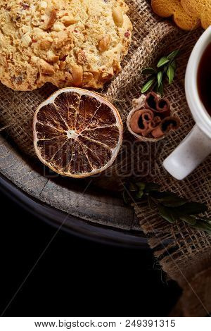Cookies With Cinnamon And Two Cups Of Tea On A Burlap Napkin, Selective Focus, Close-up, Top View. D