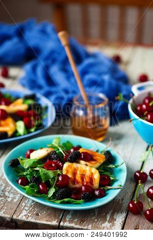 Grilled Halumi  Cheese Salad With Berries.food Gathering.selective Focus