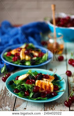 Grilled Halumi  Cheese Salad With Berries.food Gathering.selective Focus