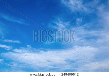 Beautiful Blue Sky With Fleecy Clouds. Abstract Background.