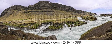 Panoramic Long Exposure Of Rapids And Small Waterfalls On The Fossálar River In Southern Iceland.