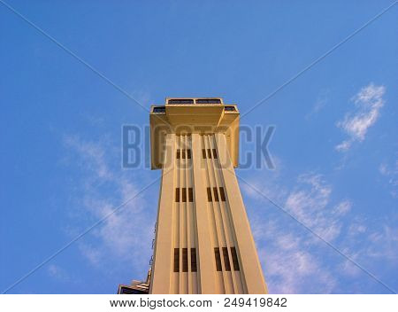 Tower Of The Lacerda Elevator In Salvador, Bahia, Brazil, In Front Of A Blue Sky With Clouds. Upside