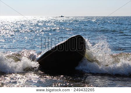 Atlantic Ocean Waves Crashing Against A Rock In Birch Plain, Cape Breton.