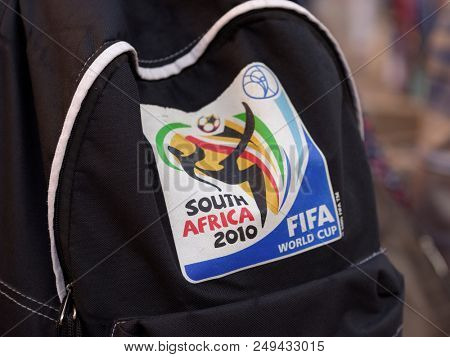 ST. PETERSBURG, RUSSIA - JULY 13, 2018: Logo of FIFA World Cup South Africa 2010 on the backpack of a football fan visited FIFA World Cup Russia 2018. Saint Petersburg host 7 matches of FIFA World Cup