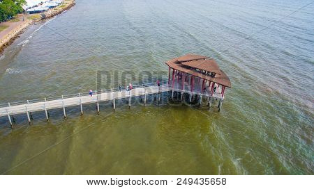 Sipitang,sabah-july 6,2018:aerial View Of The Wooden Pier Or Jetty With Hut At Esplanade In Sipitang