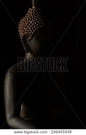 Limestone Buddha In Shadow And Light