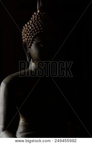 Limestone Buddha In Shadow