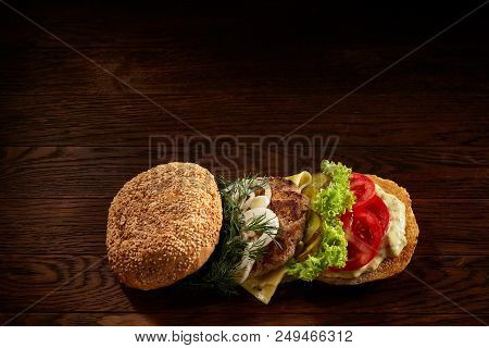 Close-up Of Delicious Fresh Home Made Burger With Piccoli, Lettuce, Cheese, Onion, Tomato, Dill And 