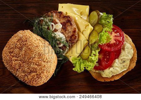 Close-up Of Delicious Fresh Home Made Burger With Piccoli, Lettuce, Cheese, Onion, Tomato, Dill And 