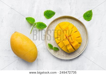 Healthy Breakfast. Sliced Mango Fruit On Plate. Top View. Concrete Background With Copy Space.