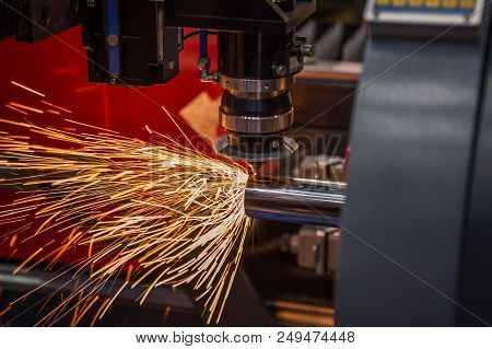 Cnc Laser Cutting Machine Operate In Factory For Cutting Steel Tube, This Immage Can Use For Industr