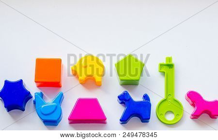 Set Of Toys For Babies On A White Table