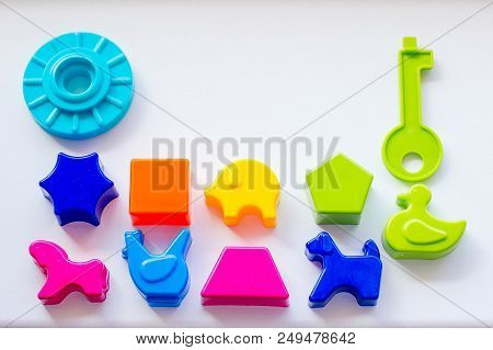 Set Of Toys For Babies On A White Table