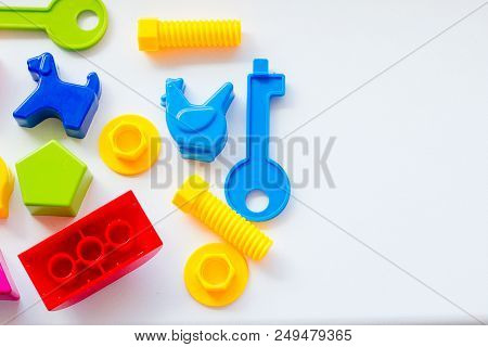 Set Of Toys For Babies On A White Table