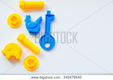 Set Of Toys For Babies On A White Table