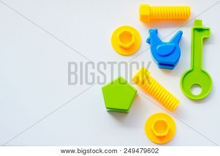 Set Of Toys For Babies On A White Table