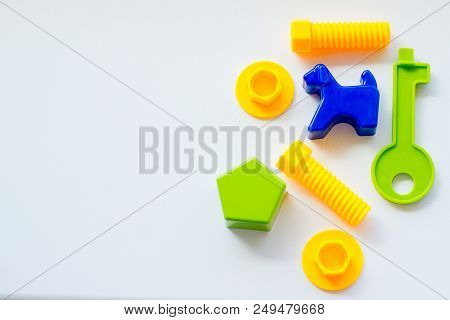 Set Of Toys For Babies On A White Table