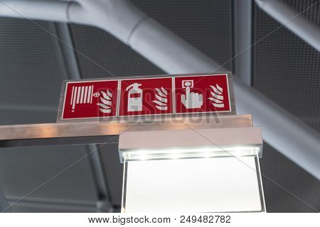 Symbols With Fire Extinguishers, Fire Hose And Fire Alarm Key At A Airport