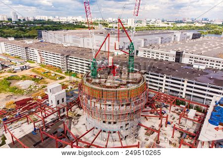Construction Site With Cranes And Building With Blue Sky Background