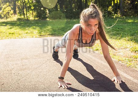 Fitness Woman Doing Push-ups During Outdoor Cross Training Workout. Beautiful Young And Fit Fitness 