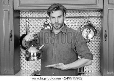 Tea Mood, Tea Time, Breakfast, Morning. Man In Blue Shirt Point Hand At Kettle. Kitchen Appliance An