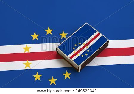 Cabo Verde Flag  Is Pictured On A Matchbox That Lies On A Large Flag.