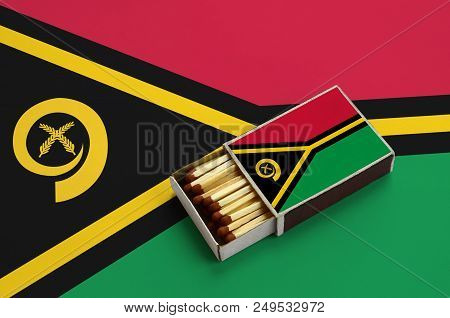 Vanuatu Flag  Is Shown In An Open Matchbox, Which Is Filled With Matches And Lies On A Large Flag.