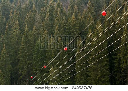 High Voltage Power Line With Big Ball For Warning Pilots, Low Flying Aircraft And Helecopter.