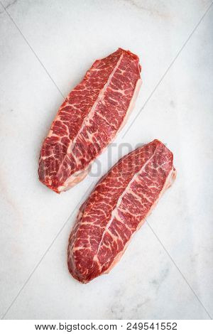 Raw Fresh Meat Top Blade Steaks On Light Background. Top View.