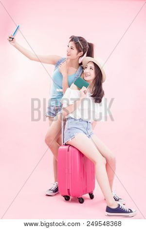 Two Beauty Woman Selfie Happily With Travel Concept On The Pink Background
