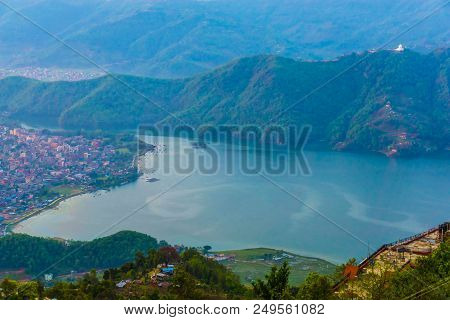 Begnas Tal, Nepal With The Annapurna Himalaya Visible In The Background At Sunset