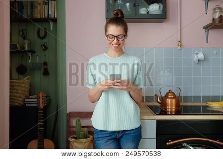 Indoor Picture Of Young Good-looking European Woman Dressed In Casual Clothes And Wearing Trendy Eye