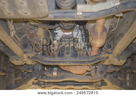 Soft Focus Of The Car Is Lifted To Check Availability Undercarriage Of Cars