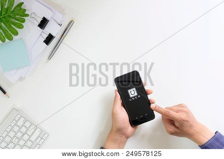 Chiang Mai,thailand - June 26, 2018 : A Man Hand Holding Uber App Showing On Huawei P10 , Uber Is Sm