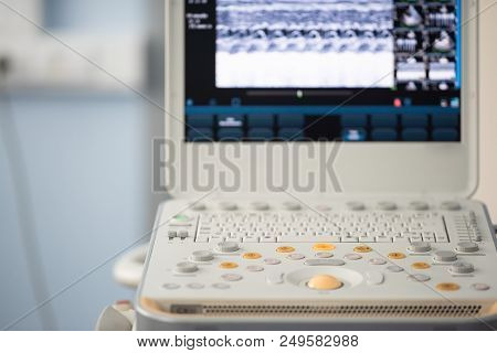 Gray And Orange Button Of The Keyboard Of The Device For Ultrasound Examination Against The Backgrou