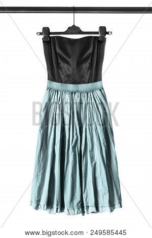 Strapless Dress With Blue Flared Skirt Hanging On Clothes Rack Isolated Over White