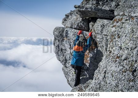 Tourist Climbs The Rock. Demerdzhi Mountain, Crimea