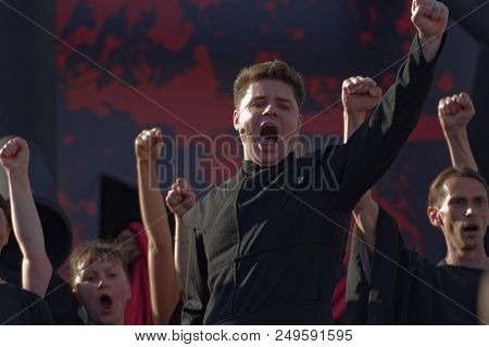 ST. PETERSBURG, RUSSIA - JULY 15, 2018: Artyom Melikhov as Macduff (center) in the opera Macbeth outdoors during the festival All Together Opera. It was 2nd of 4 performances