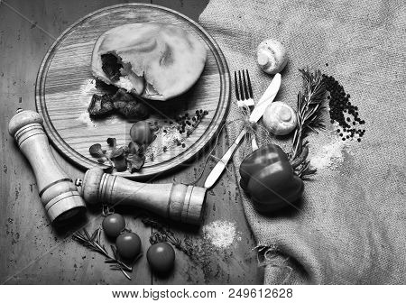 Closed Pizza With Meat Filling, Grey Background. Rustic Cuisine Concept. Roasted Meat In Small Dough