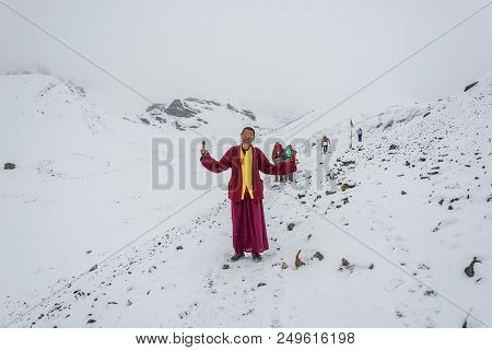 Track Around Annapurna, Nepal-07.04.2018: A Young Monk On The Snowy Thorong La Pass On April 7, 2018