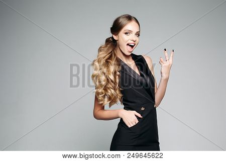 Portrait Of Emotional Pretty Girl Wearing In Black Dress, Showing Peace Sign By Fingers.pozitivity B