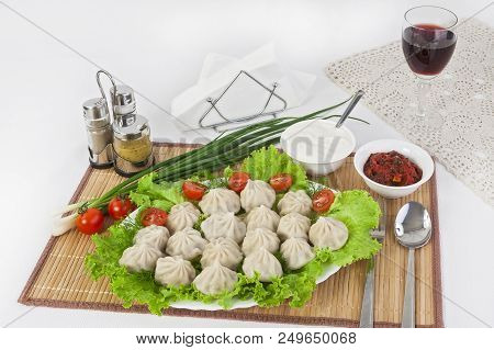 Kinkali In Green With Tomatoes And Onions. Serve With Soy Sauce And Sour Cream.