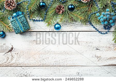 Christmas Composition With Fir Tree Branches And Christmas Decorations On White Wooden Background, T